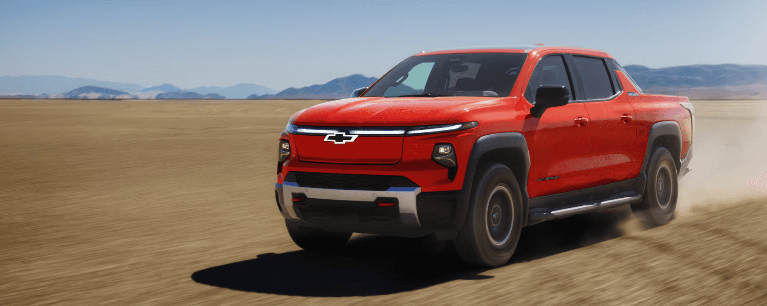 Orange Chevrolet pickup truck in the desert