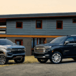 Chevrolet Suburban and Tahoe parked outside modern home