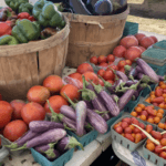 Fresh vegetables displayed at outdoor farmers market