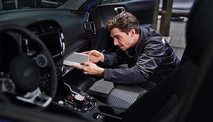A cabin air filter being installed.