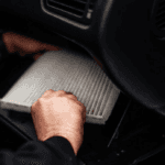 Cabin air filter being installed.