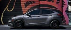 The 2021 Hyundai Kona parked in front of a painted wall.