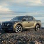 The 2022 Hyundai Santa Cruz parked on a gravel road.