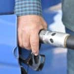 A man fills his car with gas after noticing his check engine light is on in Marion, IL.