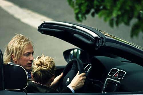 A husband and wife test drive a used Volkswagen car in Marion, IL