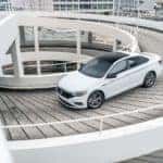 A 2020 Volkswagen Jetta drives down a parking ramp