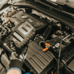 Volkswagen service mechanic testing a vw car battery in Marion, IL.