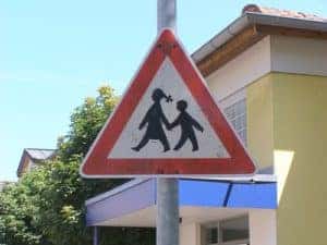A sign alerting to drive safely and watch for children