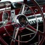 The steering wheel of a classic car at the St. Louis Car Museum