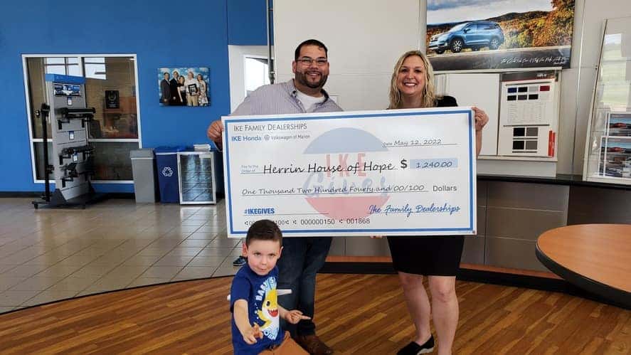 Ike Auto donates a check for $1,240 to Herrin House of Hope in Marion