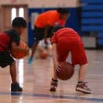 Children learn how to play basketball at a youth sports program in Marion, Illinois