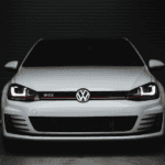 white painted VW vehicle in service department for regular maintenance.