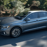 2024 Volkswagen Jetta driving down a southern Illinois road.