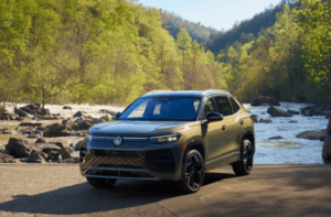 2026 Tiguan in Avocado Green paint color driving offroad.