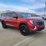 red 2025 Volkswagen Atlas SUV parked at the Volkswagen of Marion dealership in Marion, IL