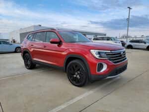 red 2025 Volkswagen Atlas SUV parked at the Volkswagen of Marion dealership in Marion, IL