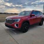a red 2026 Volkswagen Atlas SUV parked at the Volkswagen of Marion dealership in Marion, IL