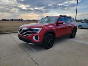 a red 2026 Volkswagen Atlas SUV parked at the Volkswagen of Marion dealership in Marion, IL
