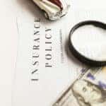 car insurance documents sitting on a table
