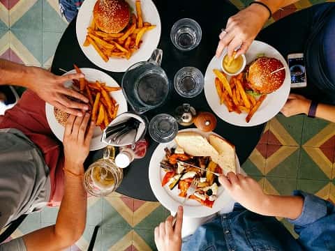 people eating food at a restaurant in Marion, IL