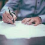 person reviewing paperwork