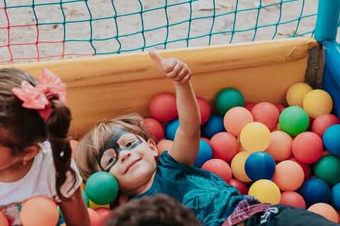 kids playing in a ball pit