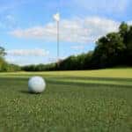 a golf ball on the green at a golf course