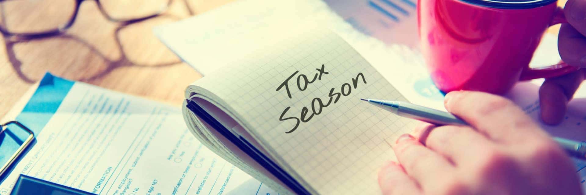 collage of tax items with a notepad that says "Tax Season"