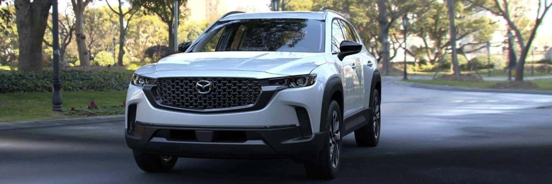 white 2025 cx-50 hybrid on road