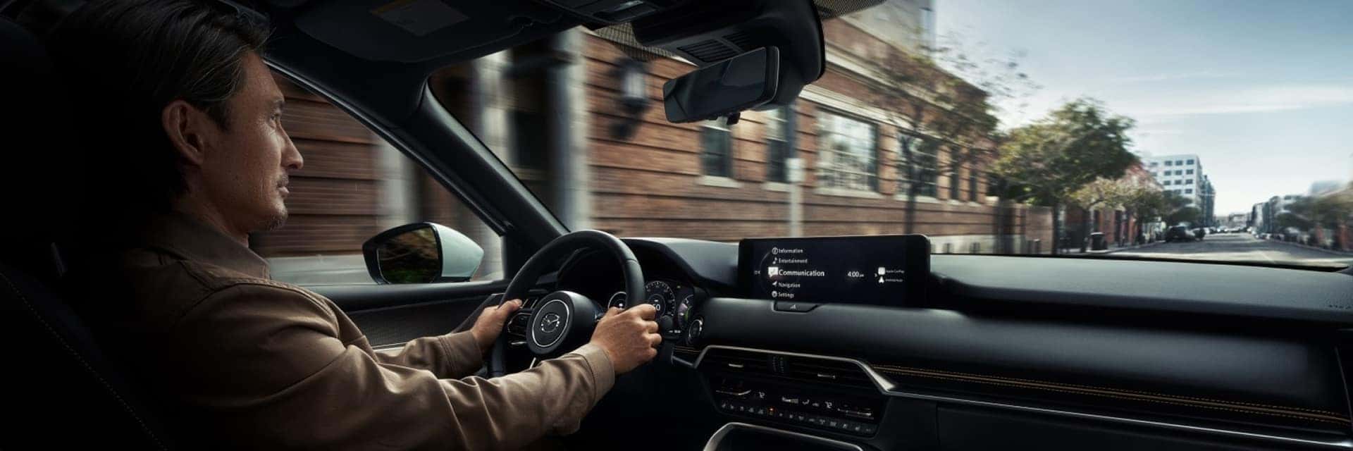 man driving cx-90 phev
