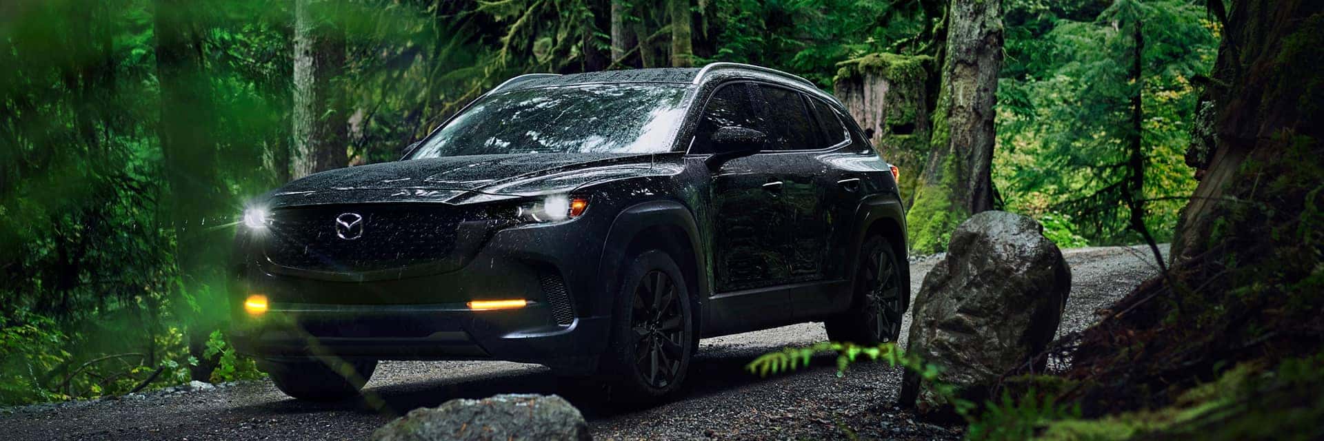 2026 mazda cx-50 in a forest in rain