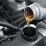 Pouring Oil To Car Engine Close,Up