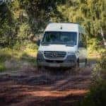 sprinter van driving on muddy road