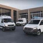 Three outfitted Mercedes-Benz Sprinter Cargo Vans in front of a brick building