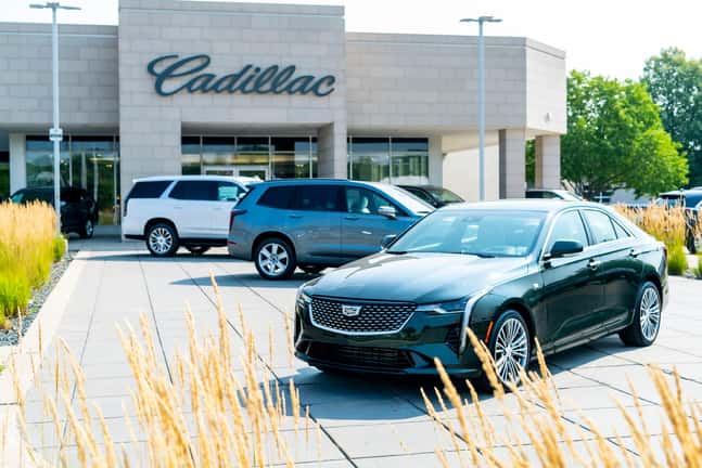 Front angle view of a white Cadillac Sedan